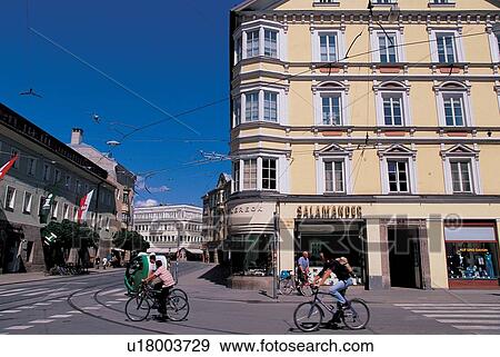 Stock Photo - outdoor, homes, buildings, cyclists, shops, travel destination, sun shine. Fotosearch