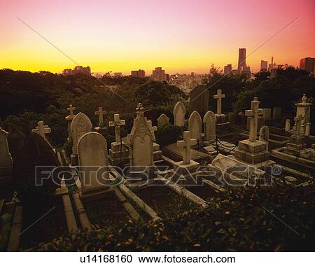 Stock Image -  a Graveyard and Its Gravestones Near the Center of Yokohama City By Sunset, High Angle View, Yokohama City, Kanagawa Prefecture, Japan. Fotosearch