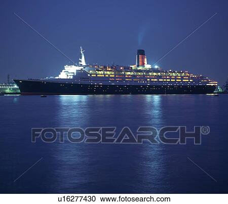 Stock Image -  a Huge Illuminated Passenger Boat Floating on the Ocean, Side View, Yokohama City, Kanagawa Prefecture, Japan. Fotosearch