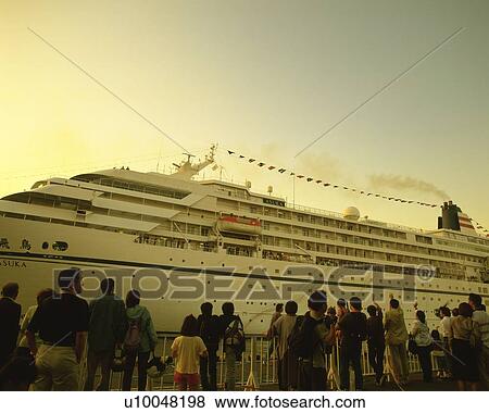 a Huge White-colored Passenger Boat, With a Large Group of People Waiting at the Harbor to Get on It, Rear View, Yokohama City, Kanagawa Prefecture, Japan View Large Photo Image Stock Photo - a Huge White-colored Passenger Boat, With a Large Group of People Waiting at the Harbor to Get on It, Rear View, Yokohama City, Kanagawa Prefecture, Japan. Fotosearch