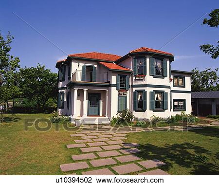 Stock Image -  a Western-styled House, Surrounded By a Garden and Trees, Side View, Yokohama City, Kanagawa Prefecture, Japan. Fotosearch