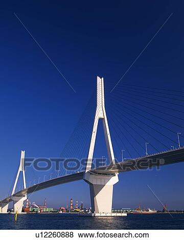 Stock Photo -  a White Bridge in Yokohama Under a Deep Blue Sky, Low Angle View, Yokohama City, Kanagawa Prefecture, Japan. Fotosearch