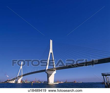 Stock Photo -  a White-colored Bride, Spreading Over the Ocean Under a Blue Sky, Low Angle View, Yokohama City, Kanagawa Prefecture, Japan. Fotosearch