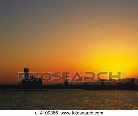 Stock Photograph -  Sakuragicho, the Marine Tower and Mt. Fuji and the Ocean In Front of It By Sunset, Front View, Far View, Yokohama City, Kanagawa Prefecture, Japan. Fotosearch