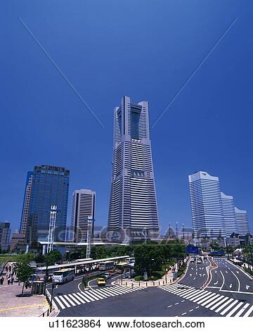 Picture -  Several Buildings and Skyscrapers Behind a Road, Front View, Yokohama City, Kanagawa Prefecture, Japan. Fotosearch