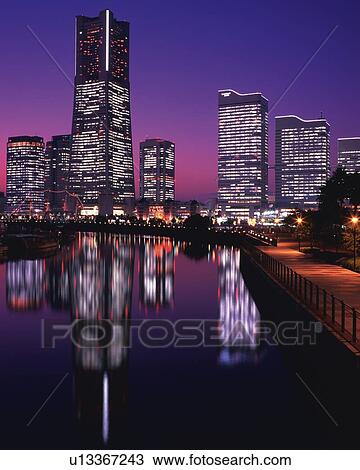 Several Buildings and the Landmark Tower By Sunset, Their Lights Reflected in the Water In Front, Yokohama City, Kanagawa Prefecture, Japan View Large Photo Image Stock Image - Several Buildings and the Landmark Tower By Sunset, Their Lights Reflected in the Water In Front, Yokohama City, Kanagawa Prefecture, Japan . Fotosearch