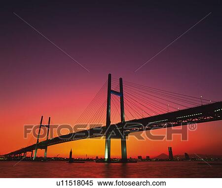 the Yokohama Bay Bridge By Sunset, the Sky Reflecting the Colors of the Sun, Low Angle View, Yokohama City, Kanagawa Prefecture, Japan View Large Photo Image Stock Photography - the Yokohama Bay Bridge By Sunset, the Sky Reflecting the Colors of the Sun, Low Angle View, Yokohama City, Kanagawa Prefecture, Japan. Fotosearch