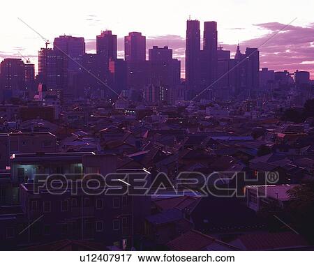 Stock Photo - High rise buildings, sunrise. Fotosearch