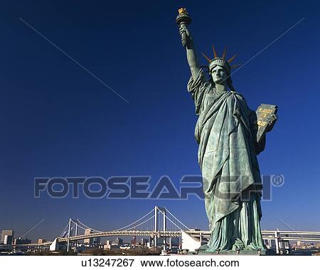 Stock Photo - Statue of Liberty and rainbow bridge. Fotosearch