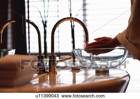 Stock Image -  a Hotel Guest Washing Hands in the Bathroom of the Grand Hyatt Shanghai, Side View, Differential Focus, Shanghai, China. Fotosearch