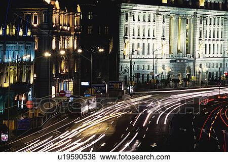a Huge Road at Night and Several Cars Driving on it, With Some Buildings on the Side, High Angle View, Long Exposure, Shanghai, China View Large Photo Image Stock Photo - a Huge Road at Night and Several Cars Driving on it, With Some Buildings on the Side, High Angle View, Long Exposure, Shanghai, China. Fotosearch