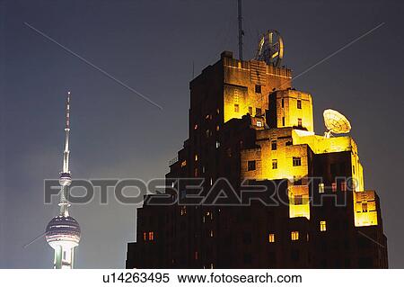 an Illuminated Western-styled Building Next to the Top of the Oriental Pearl Tower, Low Angle View, Shanghai, China View Large Photo Image Stock Photography - an Illuminated Western-styled Building Next to the Top of the Oriental Pearl Tower, Low Angle View, Shanghai, China. Fotosearch