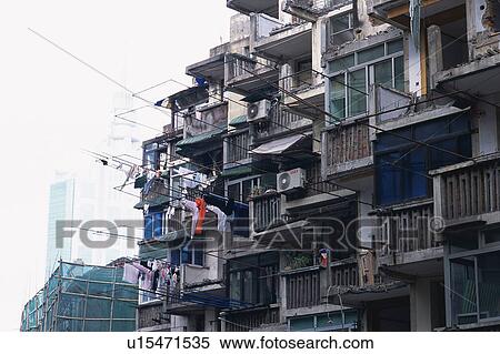 Stock Photography -  an Old Apartment House With Some Laundry Hanging Outside, Low Angle View, Shanghai, China. Fotosearch