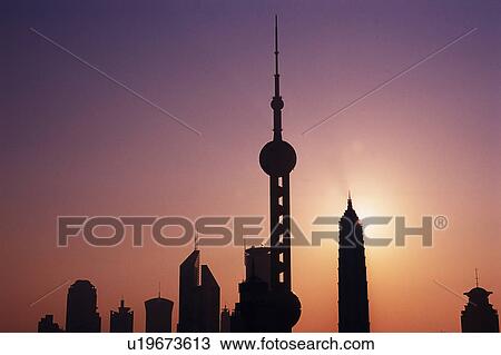 Stock Image -  Several Shanghai Buildings By Sunset, the Oriental Pearl Tower also Visual, Low Angle View, Shanghai, China. Fotosearch