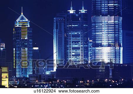 Picture -  Several Shanghai Buildings Illuminated in a Blue Toned at Night, Front View, Shanghai, China. Fotosearch