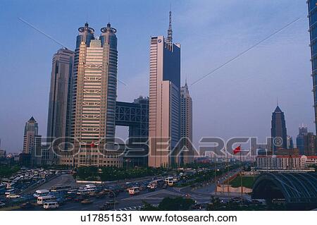 Several Shanghai Buildings In Front of a Huge Road Under a Blue Sky, Low Angle View, Shanghai, China View Large Photo Image Stock Image - Several Shanghai Buildings In Front of a Huge Road Under a Blue Sky, Low Angle View, Shanghai, China. Fotosearch