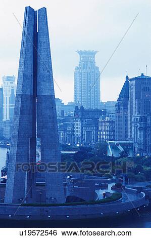 Stock Photograph -  Several Shanghai Buildings on a Rainy Day Under a Grey Sky, Front View, Shanghai, China. Fotosearch