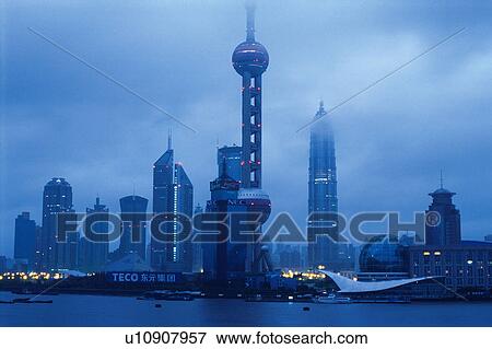 Several Shanghai Buildings, the Oriental Pearl Tower also Visual Under a Grey Sky, Low Angle View, Shanghai, China View Large Photo Image Stock Photo - Several Shanghai Buildings, the Oriental Pearl Tower also Visual Under a Grey Sky, Low Angle View, Shanghai, China. Fotosearch