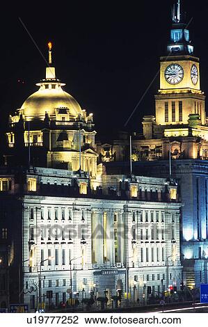 Stock Image -  Several Western-styled Buildings in Shanghai by Night, Illuminated, Front View, Shanghai, China. Fotosearch