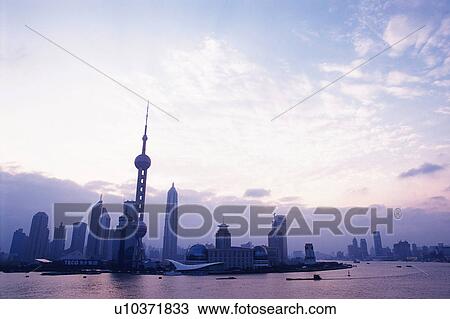 Shanghai City Under a Light Sky, Surrounded By the Ocean Water, Low Angle View, Shanghai, China View Large Photo Image Stock Image - Shanghai City Under a Light Sky, Surrounded By the Ocean Water, Low Angle View, Shanghai, China. Fotosearch