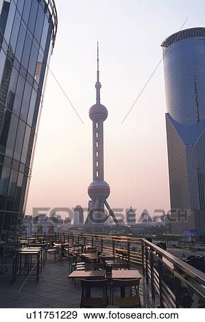 the The Oriental Pearl TV Tower By Sunset, Surrounded By Buildings, Low Angle View, Shanghai, China View Large Photo Image Stock Photo - the The Oriental Pearl TV Tower By Sunset, Surrounded By Buildings, Low Angle View, Shanghai, China. Fotosearch