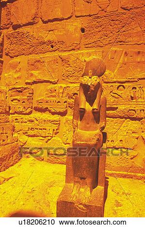 Stock Image - A stone statue inside a tomb, Egypt, Low Angle View. Fotosearch