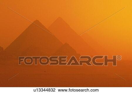 Stock Image - Pyramids in the sunset, Egypt, Low Angle View. Fotosearch