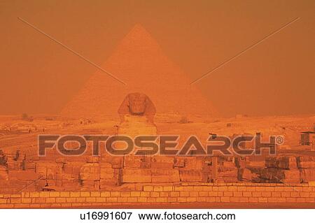Stock Photo - Sphinx and Pyramid in the sunset, Egypt, Low Angle View. Fotosearch