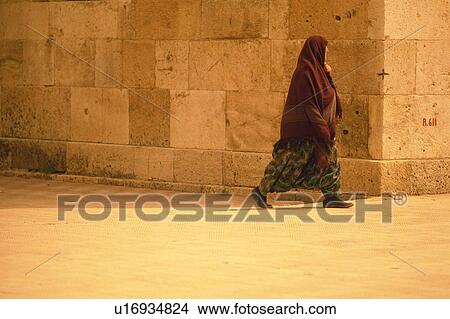 A woman on the street of Istanbul, Turkey, Side View View Large Photo Image Picture - A woman on the street of Istanbul, Turkey, Side View. Fotosearch