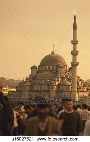 Stock Image - People and a mosque, Turkey, Low Angle View. Fotosearch