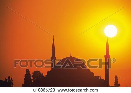 Stock Image - The sun and the Islamic temple, Turkey, Silhouette. Fotosearch