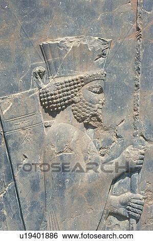 Stock Photograph - Wall relief from the site of Persepolis, Iran, Close Up. Fotosearch