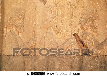 Stock Photograph - Wall relief from the site of Persepolis, Iran, Close Up. Fotosearch