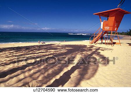 Stock Image -  a Beach With a Red-colored Observation Point, Side View, Hawaii, USA. Fotosearch