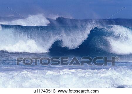 Stock Image -  a Big Wave, the Water Splashing in Many Directions, Front View, Hawaii, USA. Fotosearch
