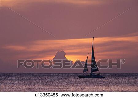 a Sailing Boat Floating on the Ocean Water By Sunset, Side View, Hawaii, USA View Large Photo Image Stock Photography - a Sailing Boat Floating on the Ocean Water By Sunset, Side View, Hawaii, USA. Fotosearch