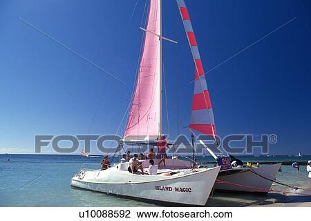 a Sailing Boat With Several People On it, Side View, Hawaii, USA View Large Photo Image Stock Image - a Sailing Boat With Several People On it, Side View, Hawaii, USA. Fotosearch