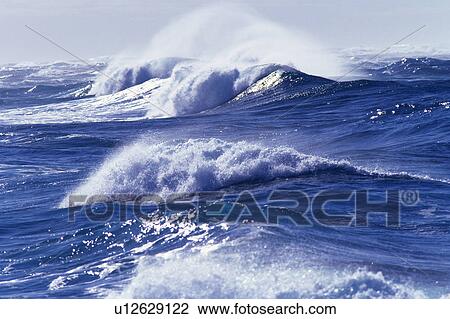 Stock Image -  Several Ocean Waves, the Water Splashing in Many Directions, Hawaii, USA. Fotosearch