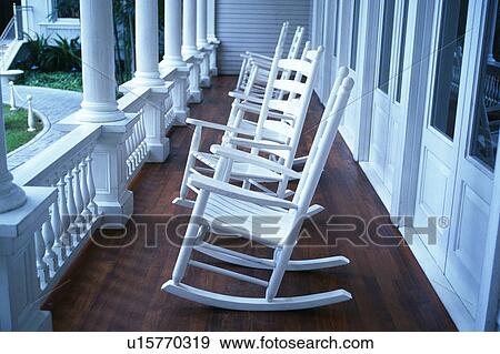 Stock Photo -  Several Rocking Chairs on a Porch, Side View, Hawaii, USA. Fotosearch