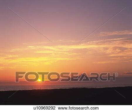 Stock Image -  a Mountain and the Sky, Reflecting the Colors of a Sunset, Front View, Far View, Hokkaido Prefecture, Japan. Fotosearch
