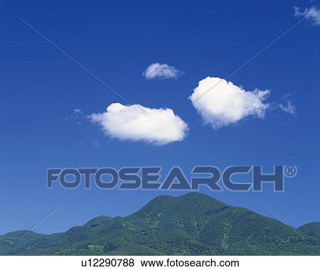 Stock Photo -  a Mountain Under a Deep Blue Sky, Hokkaido Prefecture, Japan. Fotosearch