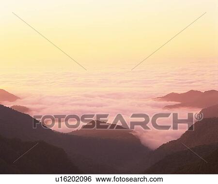 a Sea of Clouds, Reflecting Pink From the Sun, Hokkaido Prefecture, Japan View Large Photo Image Stock Photograph - a Sea of Clouds, Reflecting Pink From the Sun, Hokkaido Prefecture, Japan. Fotosearch
