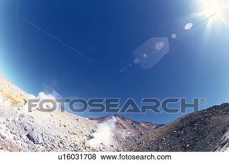 the Asahidake Mountain under a Blue Sky, the Sun Shining, Low Angle View, Lens Flare, Hokkaido Prefecture, Japan View Large Photo Image Stock Photo - the Asahidake Mountain under a Blue Sky, the Sun Shining, Low Angle View, Lens Flare, Hokkaido Prefecture, Japan. Fotosearch