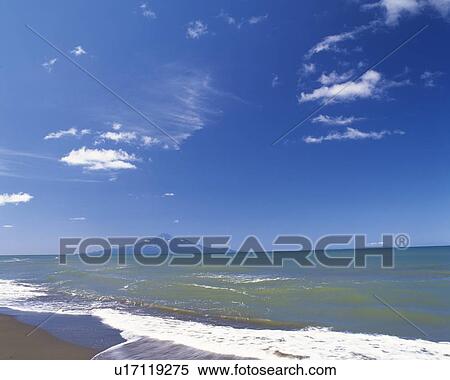 Stock Photography -  the Mt. Rishiri Under a Blue Sky, the Ocean In Front, Far View, Hokkaido Prefecture, Japan. Fotosearch