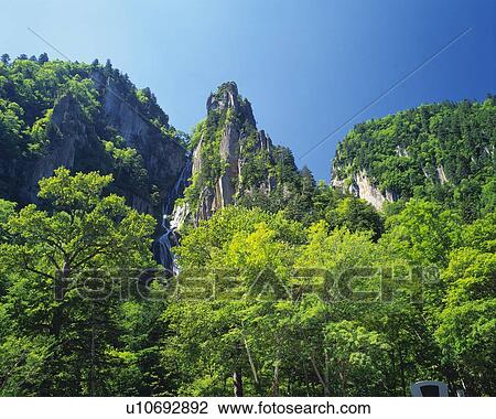 the Sounkyo Cliff, Surrounded By Trees and Green Bushes, Low Angle View, Hokkaido Prefecture, Japan View Large Photo Image Stock Image - the Sounkyo Cliff, Surrounded By Trees and Green Bushes, Low Angle View, Hokkaido Prefecture, Japan. Fotosearch