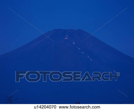 Stock Image - Lights of mountain huts in Mt. Fuji, Yamanakako village, Yamanashi prefecture, Japan, copy space. Fotosearch