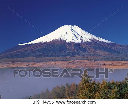 Stock Photography - Mt. Fuji and morning haze, Yamanakako village, Yamanashi prefecture, Japan. Fotosearch