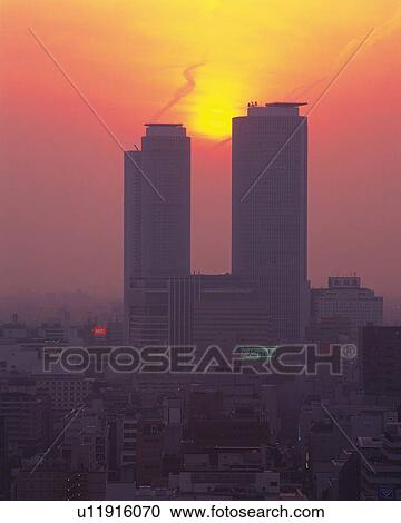 Stock Image - JR Central Towers and Sunset, Nagoya City, Japan, Front View. Fotosearch
