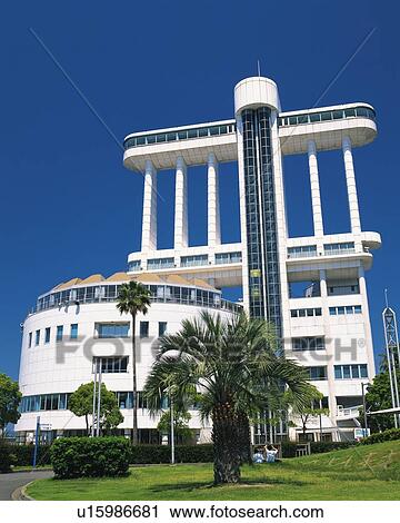 Stock Image - Port of Nagoya Port Building, Nagoya City, Japan, Low Angle View, Pan Focus. Fotosearch