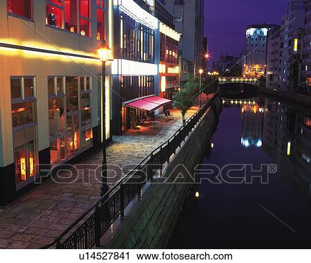Stock Image - River and Restaurants, Nagoya City, Japan, High Angle View, Long Exposure. Fotosearch